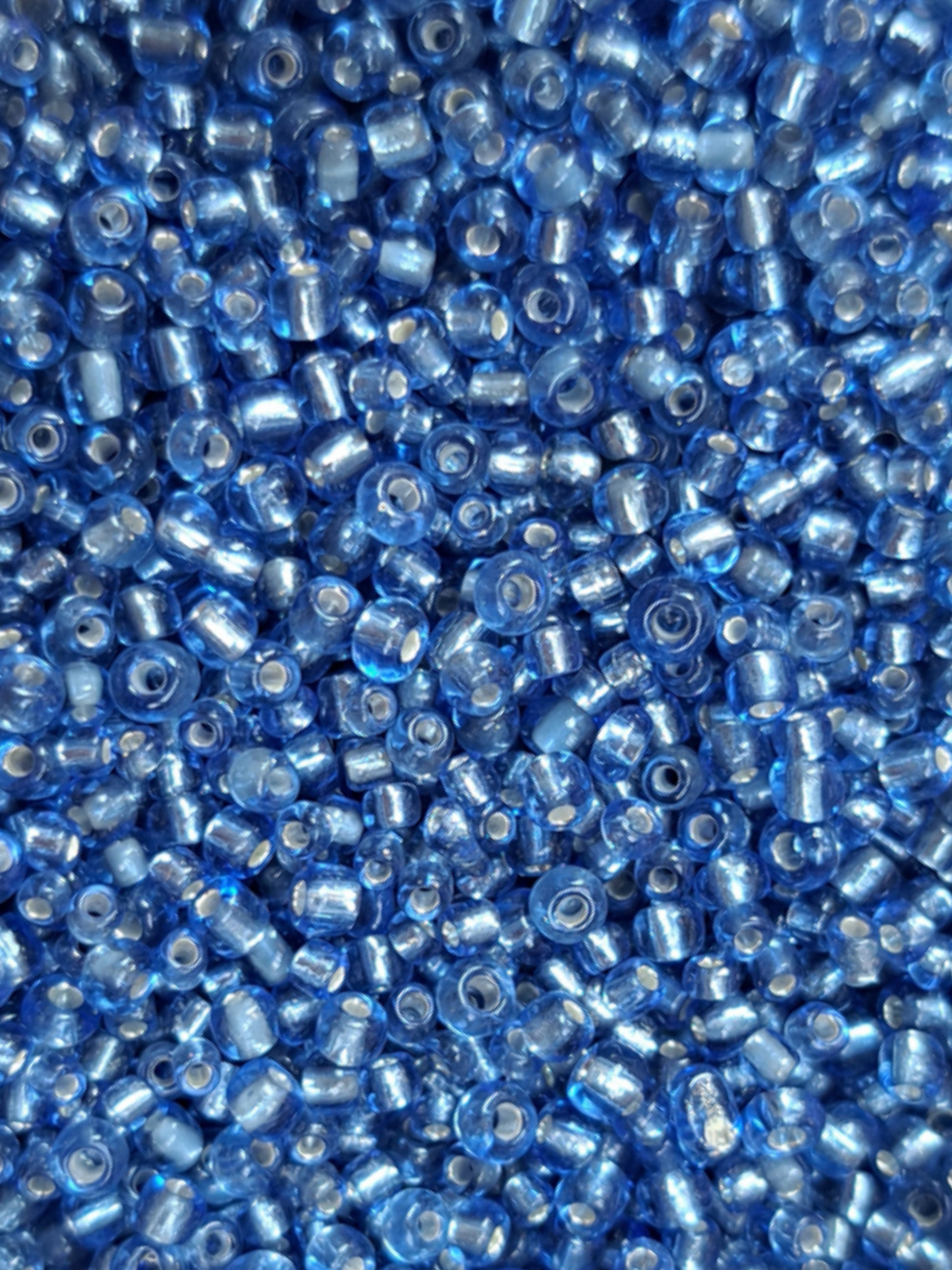 Rocailles hemel blauw zilverfolie 86ID255